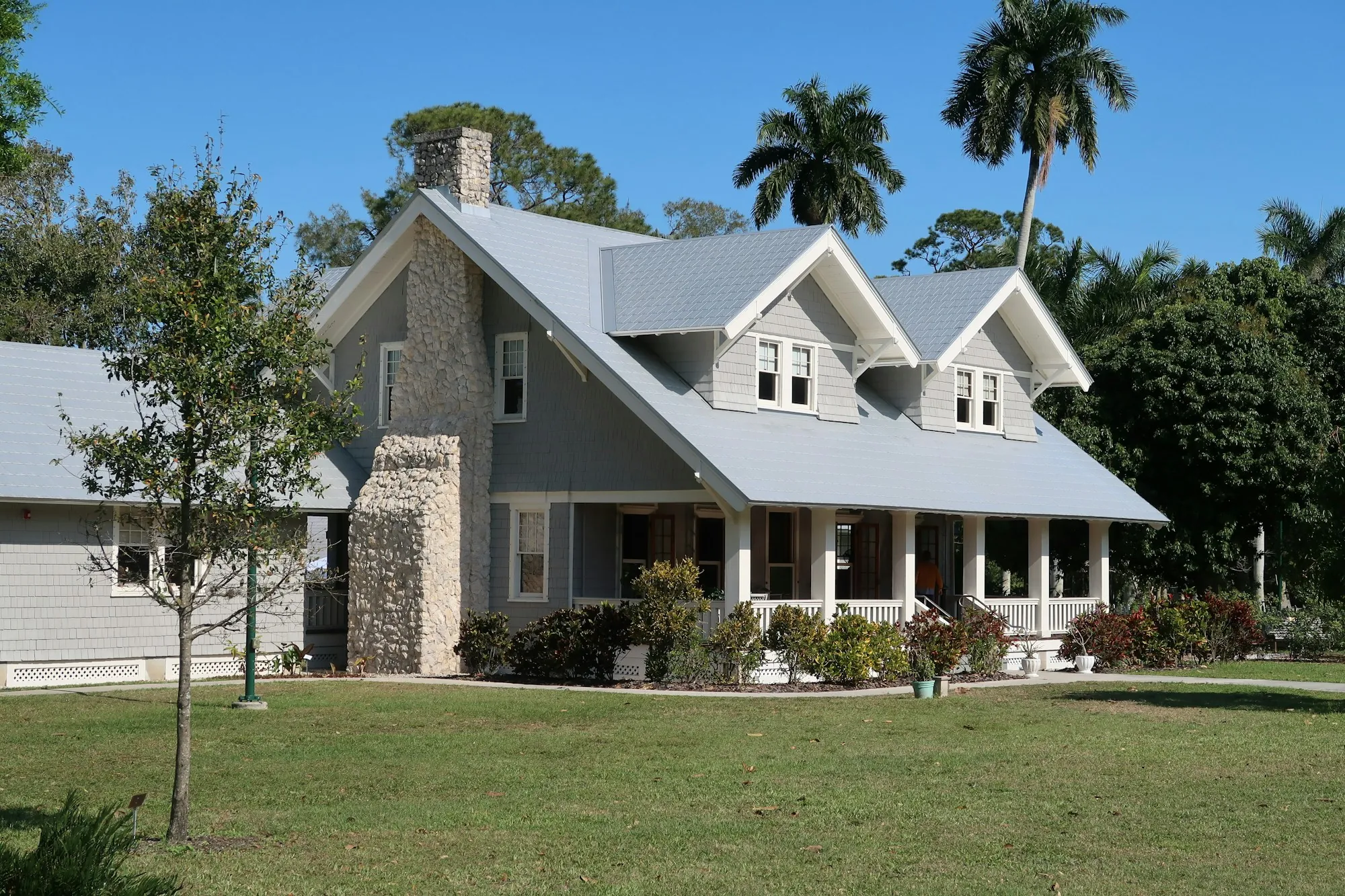 Gray house with a porch and green lawn