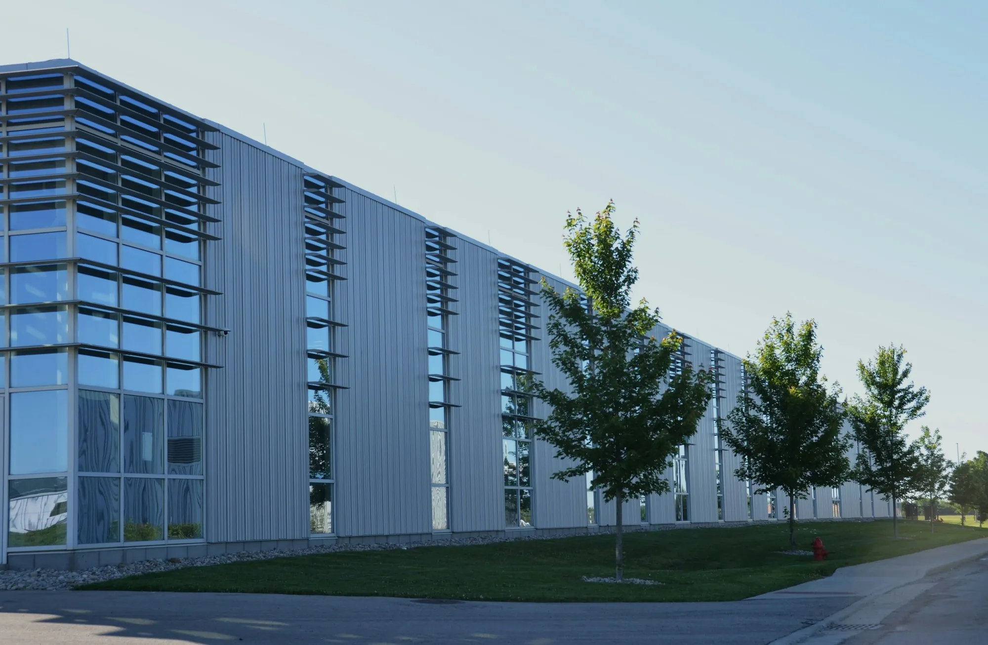 Long commercial building with trees